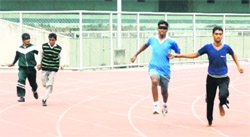 Blind players take part in track events during the NFB National Sports For Blind at Guru Nanak Stadium in Ludhiana on Saturday.