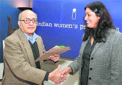 Kanchan Vasdev, Principal Correspondent with The Tribune, receives Prabha Dutt Fellowship-2009 for excellence in journalism from columnist and author Inder Malhotra in New Delhi on Saturday.