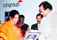 Devki Devi receives Micro Entreprenuer Award from then Union Finance Minister P Chidambaram in 2005