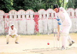 A batsman plays a shot at the Shyam Dutt Joshi Memorial Cricket Tournament in Dehradun on Sunday