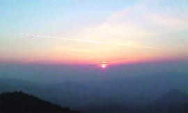 Clouds weave magic in the sky as sun sets over the hills in Shimla.