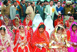 MLA Om Parkash Soni blesses the newlywed brides during a mass marriage function organised by the Bhartiya Dalit Samaj Morcha in Amritsar on Sunday