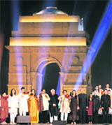 Artistes and victims of blasts in Mumbai and Delhi sing the National Anthem at a programme on the first anniversary of the final day of the siege of 26/11, in New Delhi on Sunday.