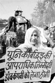 Survivors of the Bhopal gas tragedy demonstrate against Dow Chemicals ahead of the 25th anniversary of the Bhopal gas disaster in Bhopal on Sunday.