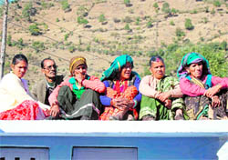 Residents enjoy the bright sunshine at Pontyi village of Uttarkashi district. Tribune photo: Anil P Rawat