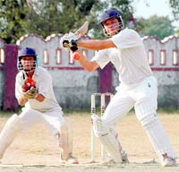 A batsman plays a shot at the Shyam Dutt Joshi Memorial T 20 Cricket Tournament in Dehradun on Monday