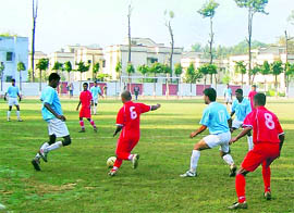 Players vie for the ball at the All-India Police Football Championship in Haridwar