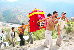 A doli carrying a bride being taken to a destination in Garhwal hills