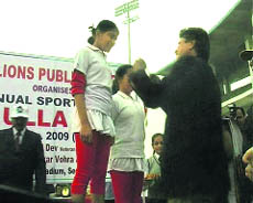 Former Indian cricketer Kapil Dev gives away prizes to outstanding students during the Annual Sports Day function of Lions Public School in Gurgaon.