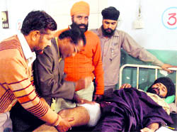 The auto-driver, who was injured in the shootout, undergoes treatment at the Civil Hospital in Rajpura on Monday.