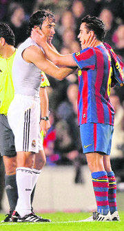 Barcelona's Xavi Hernandez (R) greets Real Madrids Raul Gonzalez at the end of their match at the Camp Nou in Barcelona on Sunday. Barcelona won the El Classico 1-0 with Zlatan Ibrahimovic scoring the winner. 