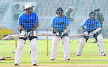 Virender Sehwag, Sachin Tendulkar and Rahul Dravid bat in the nets on Monday.