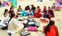 On a cold day, students of the Khalsa College for Women have a warm chat under the sun on the campus ground in Amritsar