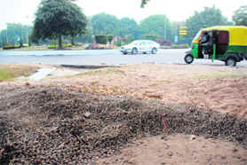 Study in contrast: An open space presents a shabby look while a roundabout in the background is beautifully maintained in Chandigarh.