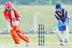 A batsman plays a shot during a match at Tau Devi Lal Cricket Stadium, Sector 3, Panchkula, on Tuesday. 