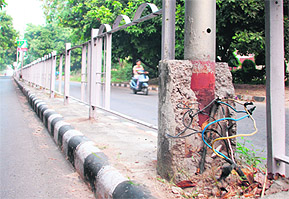 The broken junction box of a streetlight pole in Mohali.