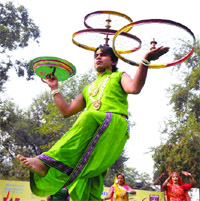 A dancer performs balancing act during an event held to commemorate World AIDS Day in New Delhi on Tuesday.