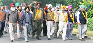 PAU employees take out a protest rally in Ludhiana on Tuesday.