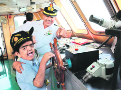 Children enjoy a harbour cruise organised by the Navy as part of the Indian Navy week celebrations at the Naval Dockyard in Mumbai