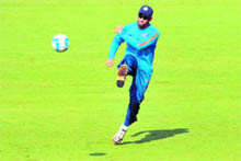 MS Dhoni plays soccer during a training session in Mumbai on Tuesday. 