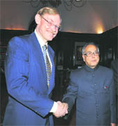 Finance Minister Pranab Mukherjee greets the World Bank president in New Delhi on Wednesday. 