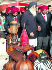 Punjab CM Parkash Singh Badal reviews a stall at the Punjab International Trade Expo, which opened at Amritsar on Wednesday.