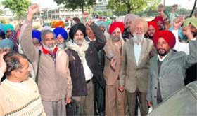 Members of the Punjab Mulazim Sangharsh Committee raise slogans in Sector 34, Chandigarh