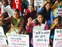 Activists of the Socialist Unity Centre of India protest against the hike in water tariff in New Delhi on Wednesday.