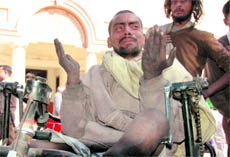 A physically challenged person in tears at a camp organised at the Municipal Corporation in Dehradun.