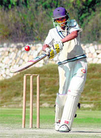 A batsman tries to play an improvised shot in the under-19 Inter-District Cricket Championship at Abhimanyu Cricket Grounds in Dehradun on Thursday. 