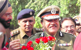 Officials welcome state DGP RS Dalal at Chaisa village, near Faridabad on Thursday.
