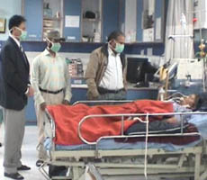 District Health Officer Dr Ashok Guru and other doctors examine the swine flu patient. 