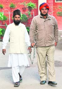Karim, an undertrial, being taken for examination in Ludhiana