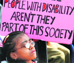 Physically-challenged take part in a rally on World Disability Day in New Delhi 