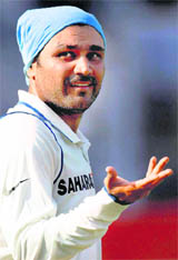 Virendra Sehwag gestures as he completes his double century on the second day of the third and final Test at the Brabourne stadium in Mumbai on Thursday.