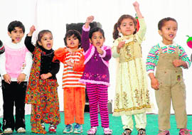 Tiny tots take part in the annual Song and Rhyme Day at Euro Kids Pre-school in Chandigarh on Friday.