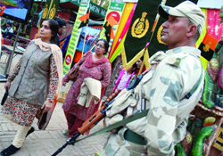 An Indo Tibetan Border Police jawan keeps vigill at the ITBP exhibition at Dilli Haat in New Delhi