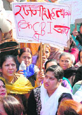 Members of the Mahila Sarankshan Samiti stage a dharna in Jammu on Friday.