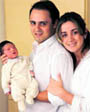 Formula One driver Felipe Massa (C) poses with his son Felipe Bassi Massa and his wife Raffaela in Sao Paulo on Thursday