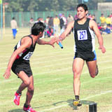 Participants take part in relay race during the Panjab University Inter-CollegeAthletics Championship in Chandigarh on Saturday.