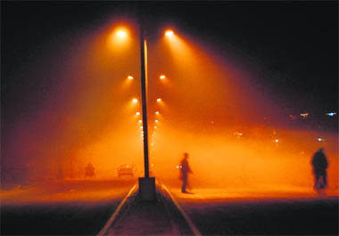 Fog has started engulfing the city at night.