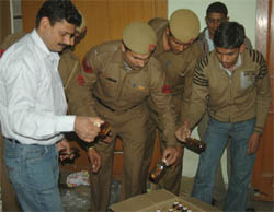 Liquor bottles seized during a raid at Sector 19 in Faridabad on Saturday.