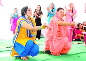 Students of Awasthi Memorial College of Education, Dharamsala, perform gidha at a college function