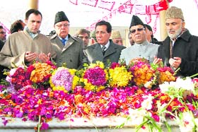 Chief Minister Omar Abdullah, along with Union minister Farooq Abdullah and state ministers, pays floral tributes at the grave of his grandfather Sheikh Abdullah at Naseembagh along the banks of the Dal Lake in Srinagar