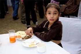 A young celiac enjoys gluten- free food at the event in New Delhi