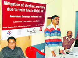BK SIngh, Warden, Rajaji National Park, (standing) addresses loco pilots at an interactive session. Dr Anil Kumar Singh, Uttarakhand Coordinator, Wildlife Trust of India, is to his left