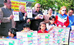 Assembly Speaker Harbans Kapoor releases a calendar and cards made by special children in Dehradun on Sunday