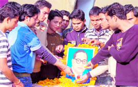 College students offer floral tributes to Dr Bhim Rao Ambedkar in Haridwar on Sunday.