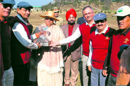 Governor Prabha Rau gives away trophy to the winning team in Shimla on Sunday.