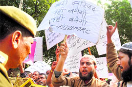 Members of the All India Babri Masjid Rebuilding Committee shout slogans at a protest in New Delhi on Sunday.